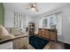 Bedroom features stylish decor, a ceiling fan, and hardwood floors at 705 Sunburst Cove Ln, Winter Garden, FL 34787