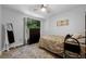Well-appointed bedroom with a TV, dresser, and decorative mirror for a comfortable and stylish space at 705 Sunburst Cove Ln, Winter Garden, FL 34787