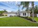 Lush lawn and landscaping frame this lovely home in a quiet neighborhood at 705 Sunburst Cove Ln, Winter Garden, FL 34787