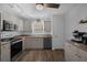 Well-lit kitchen boasts modern appliances, plenty of counter space, and streamlined design at 705 Sunburst Cove Ln, Winter Garden, FL 34787