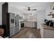 Modern kitchen featuring stainless steel appliances, ample counter space, and a neutral color palette at 705 Sunburst Cove Ln, Winter Garden, FL 34787