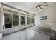 The sun room includes many windows and a ceiling fan at 705 Sunburst Cove Ln, Winter Garden, FL 34787