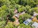 Aerial perspective showing the home surrounded by lush greenery in a peaceful neighborhood setting at 710 N Sparkman Ave, Orange City, FL 32763