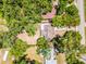 Aerial shot outlining the property within a green, tree-filled neighborhood, offering a private setting at 710 N Sparkman Ave, Orange City, FL 32763