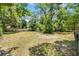 Expansive backyard featuring a shed and bordered by a white wooden fence for added privacy and security at 710 N Sparkman Ave, Orange City, FL 32763