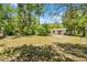 Overgrown backyard offering privacy and a natural setting for outdoor enjoyment and relaxation at 710 N Sparkman Ave, Orange City, FL 32763