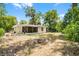 Exterior of home featuring a backyard, fire pit, and patio at 710 N Sparkman Ave, Orange City, FL 32763