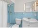 Bathroom featuring tile walls, shower and tub combo, and vanity at 710 N Sparkman Ave, Orange City, FL 32763
