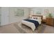 Cozy bedroom with neutral décor, two windows, and a comfortable rug at 710 N Sparkman Ave, Orange City, FL 32763