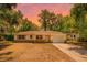 Charming single-story home with a well-maintained lawn and attached two car garage at 710 N Sparkman Ave, Orange City, FL 32763