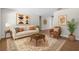 Cozy living room featuring stylish furniture, neutral tones, and natural light at 710 N Sparkman Ave, Orange City, FL 32763