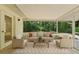 Sun Room featuring windows, a couch and chairs and a view of the backyard at 710 N Sparkman Ave, Orange City, FL 32763