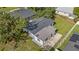 An aerial perspective of the home showing the roof, backyard and surrounding neighborhood at 7612 Pomelo Dr, Orlando, FL 32819