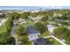 An aerial view of a neighborhood showcasing lush trees and well-maintained homes at 7612 Pomelo Dr, Orlando, FL 32819