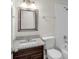 Modern bathroom with a vanity sink, mirror, and tiled shower at 7612 Pomelo Dr, Orlando, FL 32819