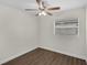Bedroom with wood floors, ceiling fan, and natural light at 7612 Pomelo Dr, Orlando, FL 32819