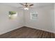 Bedroom with wood floors, natural light, and a ceiling fan at 7612 Pomelo Dr, Orlando, FL 32819