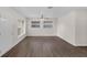 Bright living room featuring wood floors, a ceiling fan, and natural light from the windows at 7612 Pomelo Dr, Orlando, FL 32819