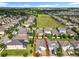 Aerial view of property showcasing lush landscaping and neighborhood at 8030 John Hancock Dr, Winter Garden, FL 34787