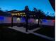 Outdoor backyard pergola with seating and string lights perfect for entertaining at 8030 John Hancock Dr, Winter Garden, FL 34787