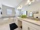 Elegant bathroom features double sinks, a soaking tub, and stylish tiled floor at 8030 John Hancock Dr, Winter Garden, FL 34787