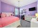Cozy bedroom with chandelier, bright walls, carpet, and ample sunlight at 8030 John Hancock Dr, Winter Garden, FL 34787