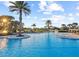 Community pool featuring tropical landscaping and a splash pad at 8030 John Hancock Dr, Winter Garden, FL 34787
