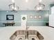 Modern kitchen featuring stainless steel sink, quartz countertops and stylish pendant lighting at 8030 John Hancock Dr, Winter Garden, FL 34787