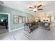 Open-concept living space with kitchen, dining, and living areas, and comfortable seating at 8030 John Hancock Dr, Winter Garden, FL 34787