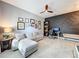Comfortable living room features gray walls, tiled floors, ceiling fan, gray sectional sofa, and stylish decor at 8030 John Hancock Dr, Winter Garden, FL 34787