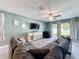 Comfortable living room with a large sectional sofa, television, and access to the outdoor space at 8030 John Hancock Dr, Winter Garden, FL 34787
