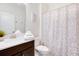 Stylish bathroom with a vanity, mirror, and decorative shower curtain for added comfort at 8982 Cabot Cliffs Dr, Davenport, FL 33896