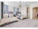 Comfortable bedroom featuring two beds, soft lighting, and neutral decor at 8982 Cabot Cliffs Dr, Davenport, FL 33896