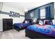 Fun, themed bedroom with modern furnishings and decor at 8982 Cabot Cliffs Dr, Davenport, FL 33896