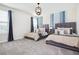 Bright, airy bedroom featuring two beds, stylish decor, and a cozy ambiance at 8982 Cabot Cliffs Dr, Davenport, FL 33896