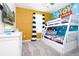 Fun bedroom with playful Toy Story decor and a mounted TV at 8982 Cabot Cliffs Dr, Davenport, FL 33896