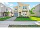 Modern two-story home with stylish facade, beautiful landscaping, and a two-car garage at 8982 Cabot Cliffs Dr, Davenport, FL 33896