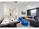 Entertainment room with air hockey, TV, foosball table, and comfortable seating at 8982 Cabot Cliffs Dr, Davenport, FL 33896