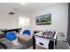 Spacious game room with a pool table, foosball, TV, and comfortable seating at 8982 Cabot Cliffs Dr, Davenport, FL 33896
