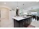Modern kitchen with granite countertops, stainless steel appliances, and open concept design at 8982 Cabot Cliffs Dr, Davenport, FL 33896