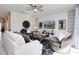 Spacious living room featuring stylish furniture, ceiling fan, and lots of natural light at 8982 Cabot Cliffs Dr, Davenport, FL 33896