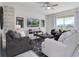 Spacious living room featuring stylish furniture, ceiling fan, and lots of natural light at 8982 Cabot Cliffs Dr, Davenport, FL 33896