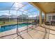 Cozy screened-in pool and spa area with lounge chairs and comfortable outdoor seating at 8982 Cabot Cliffs Dr, Davenport, FL 33896