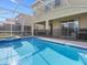 Sparkling pool and patio area ideal for outdoor relaxation and entertainment at 8982 Cabot Cliffs Dr, Davenport, FL 33896