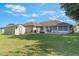 Spacious backyard features a large shed and patio area, perfect for outdoor entertaining at 929 Louvre Ct, Kissimmee, FL 34759