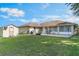 Spacious backyard features a large shed and patio area, perfect for outdoor entertaining at 929 Louvre Ct, Kissimmee, FL 34759