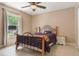 Bright bedroom with tile floors, natural light, and neutral wall paint color at 929 Louvre Ct, Kissimmee, FL 34759