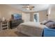 Cozy bedroom with neutral wall paint color, and access to the bathroom at 929 Louvre Ct, Kissimmee, FL 34759