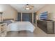 Well-lit bedroom with neutral wall paint color, and large window with decorative curtains at 929 Louvre Ct, Kissimmee, FL 34759