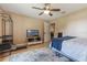 Bright bedroom with hardwood floors, shelving unit, neutral wall paint color, and a ceiling fan at 929 Louvre Ct, Kissimmee, FL 34759